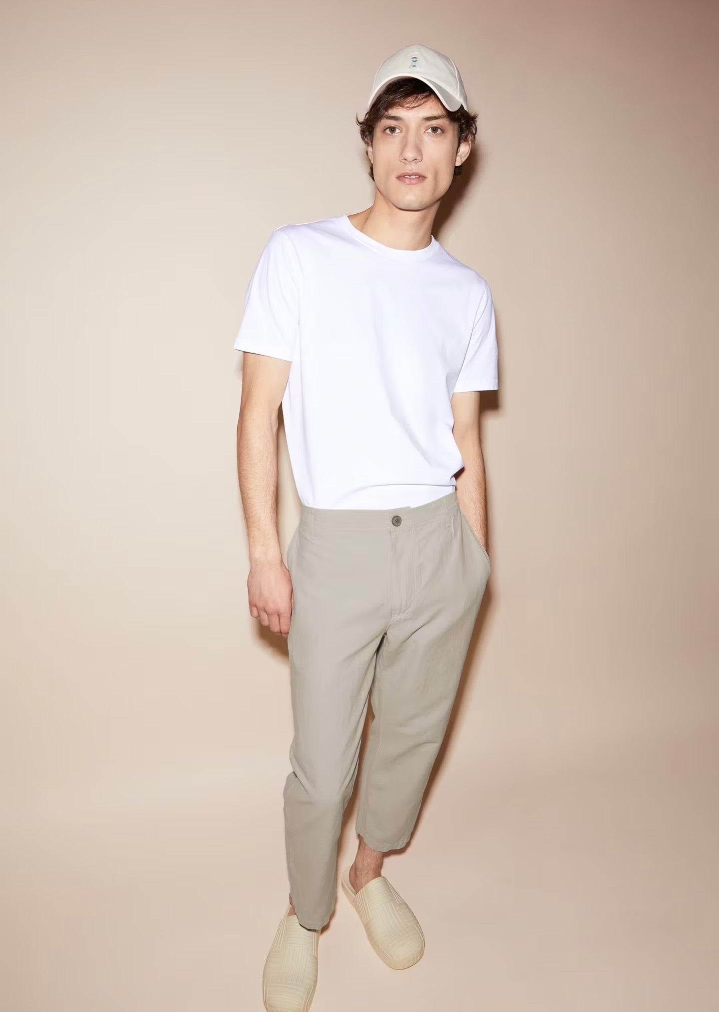 Men's ARMEDANGELS Canada cotton t-shirt in white, styled with relaxed pants and accessories