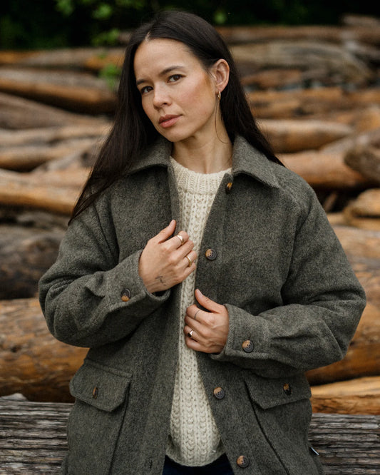 Women wearing green coat outside 