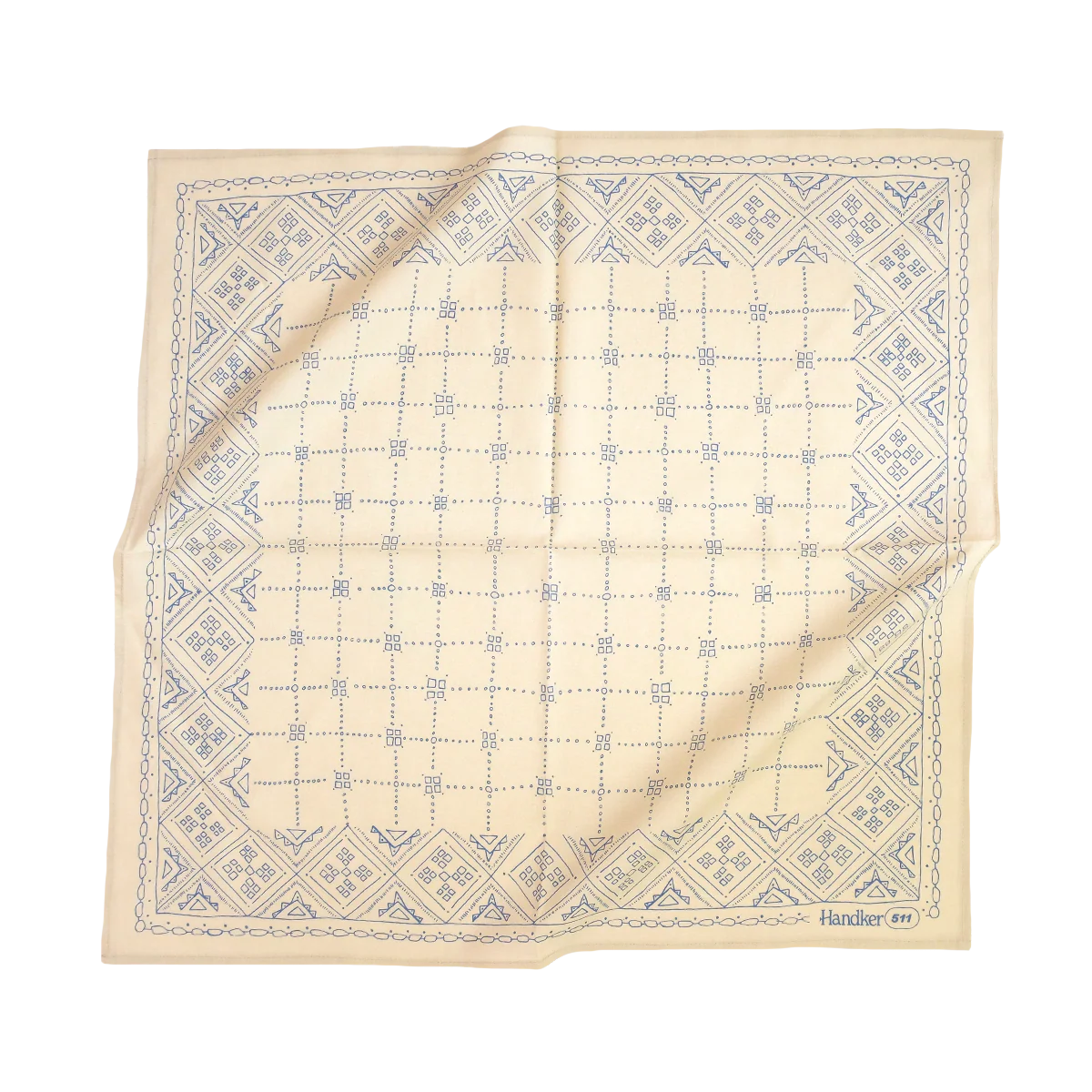 Folded beige fabric with blue geometric pattern on a white background