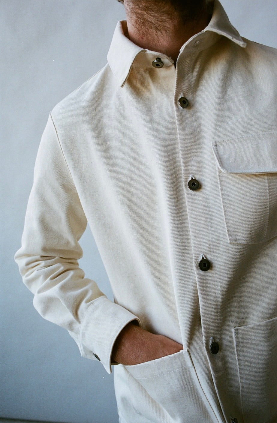 SS24 - Saturday Project - Unisex Jacket  No. 001 - The Chore Coat in Natural  - close-up front on man 3