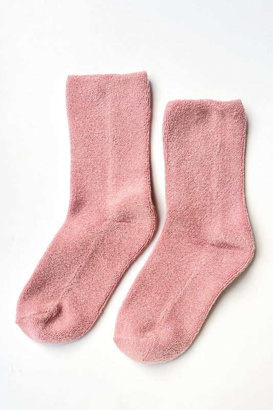 Pair of pink socks on a white background