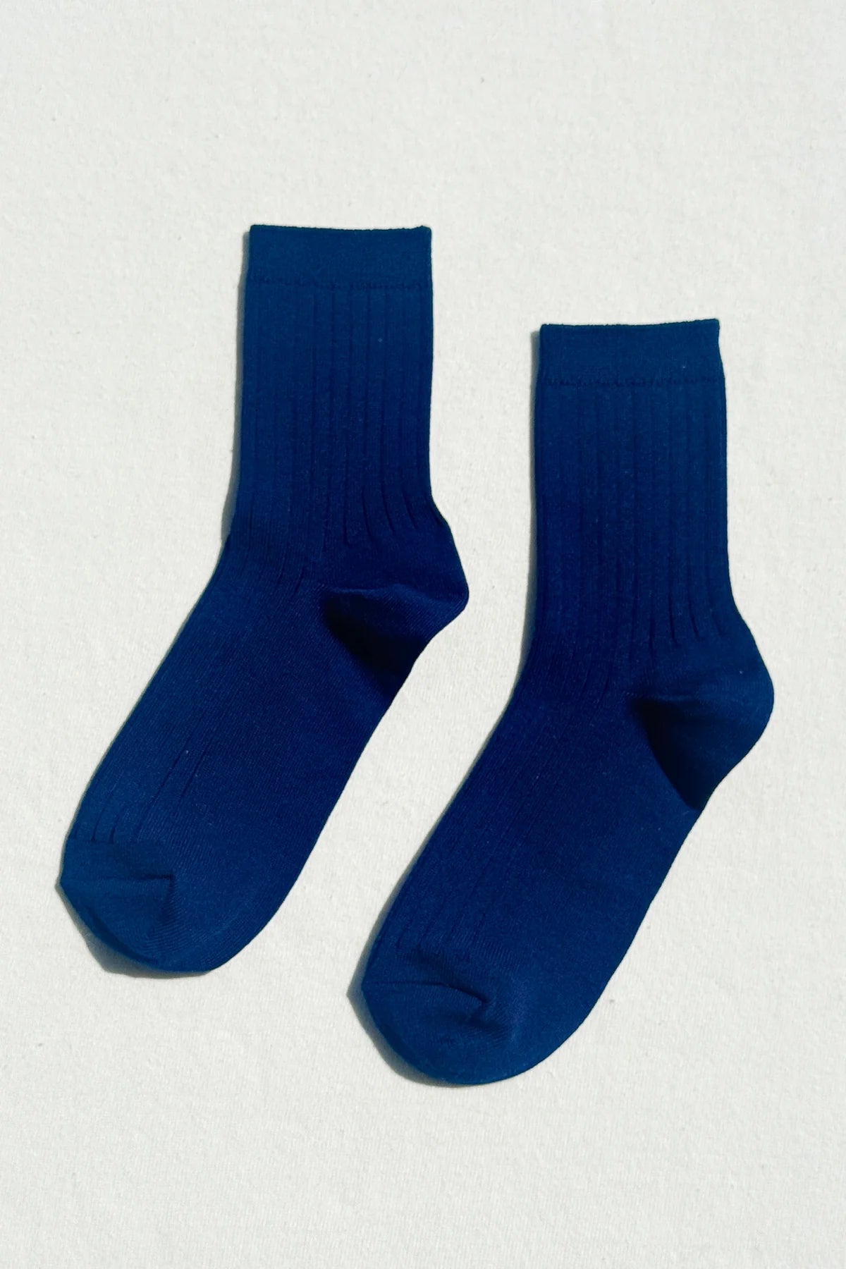 blue le bon shoppe socks in blue flatlay on white background