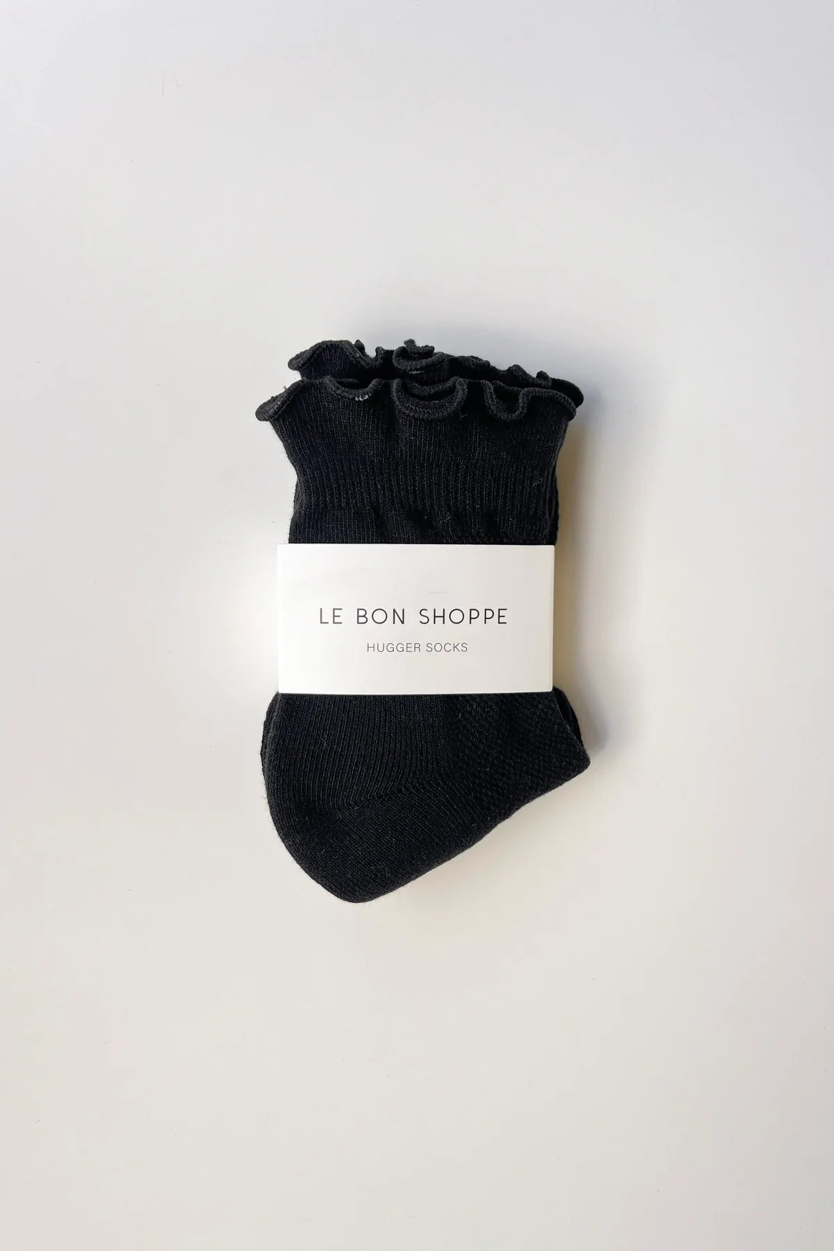 Black ankle socks with floral details on a white background, featuring 'Le Bon Shoppe' branding.