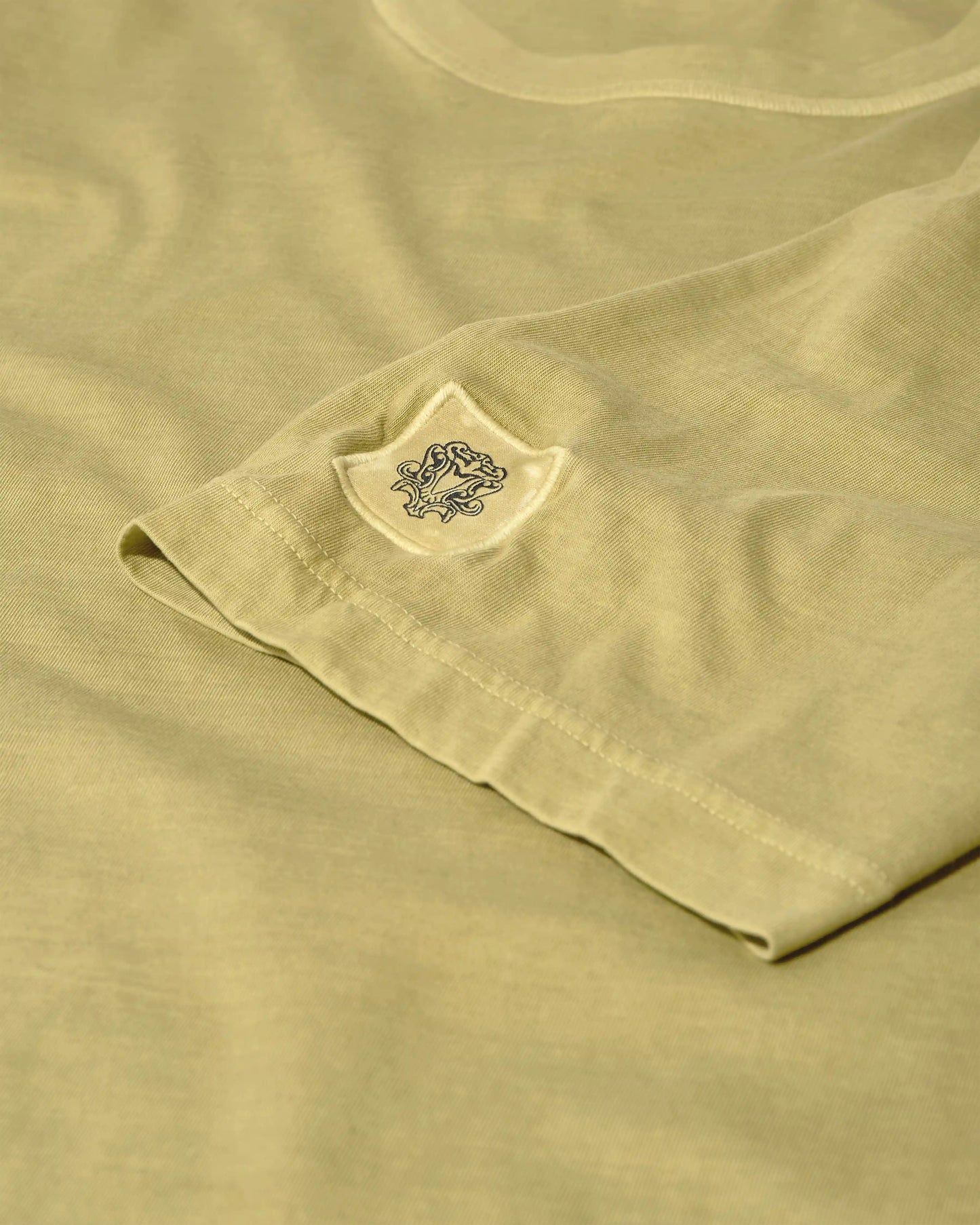 MOS MOSH Gallery Step Faded Short Sleeve T-Shirt in Moss – available in Canada - sleeve detail with MOS MOSH logo