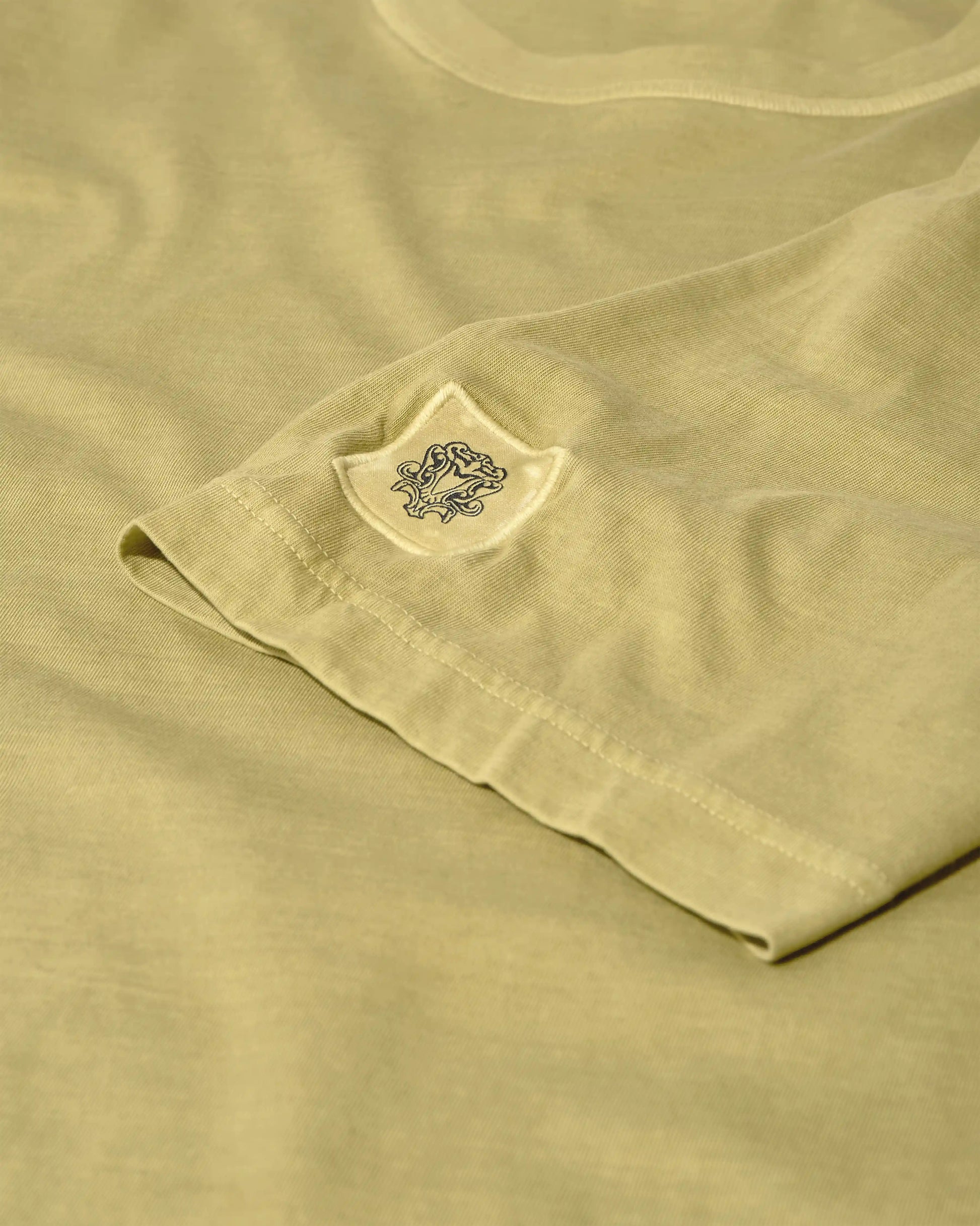 MOS MOSH Gallery Step Faded Short Sleeve T-Shirt in Moss – available in Canada - sleeve detail with MOS MOSH logo