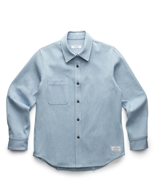 LIGHT BLUE DENIM SHIRT PRODUCT SHOT, LAID FLAT WITH WHITE BACKGROUND