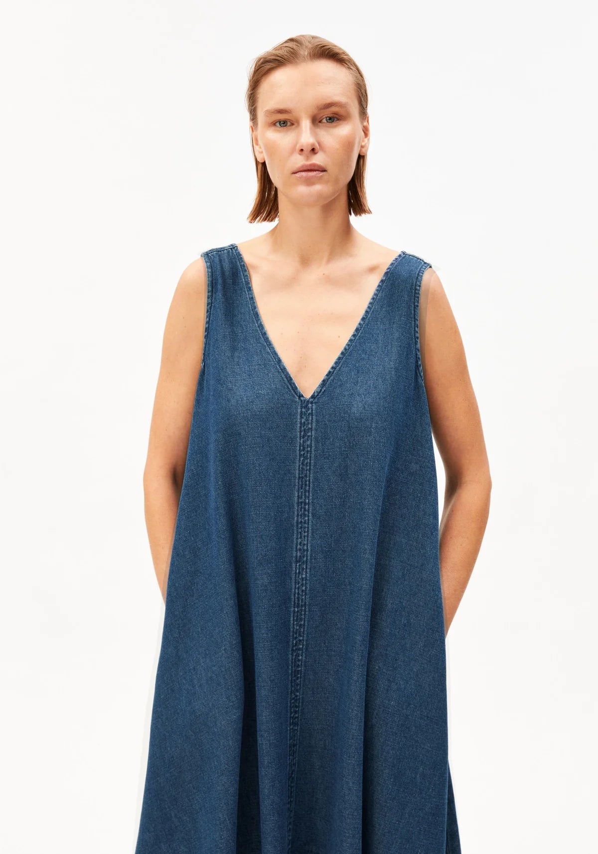 women's ARMEDANGELS Canada Denim V-Neck Midi Dress in Eau, model front medium view in Kelowna