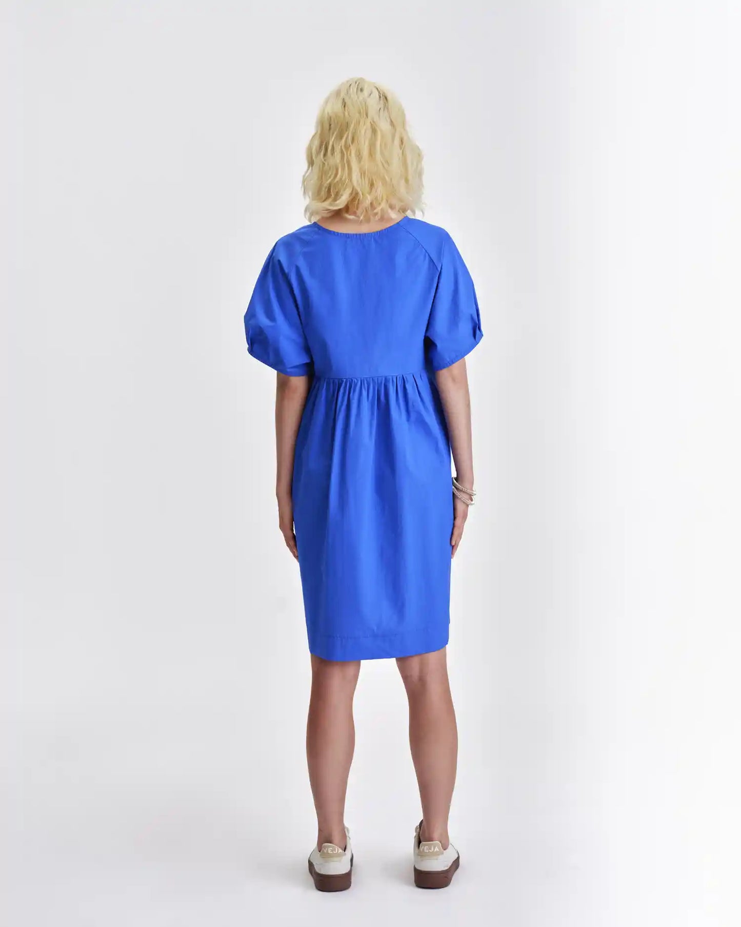 Back view of a blue Jennifer Glasgow Design dress with a relaxed fit and elastic waist