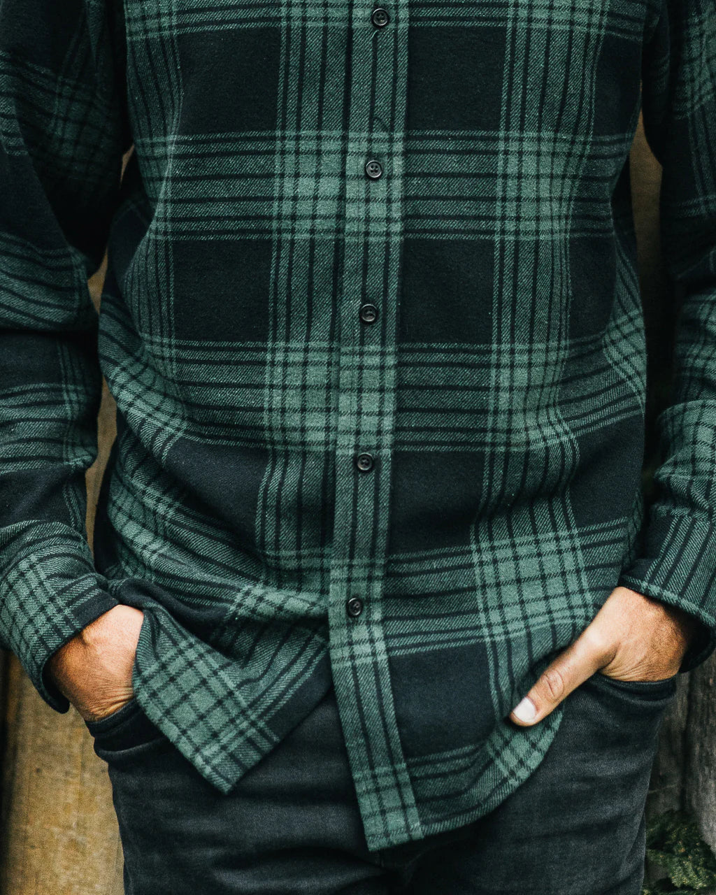 Men's plaid flannel shirt in green and black with button-down design and front pockets in Kelowna