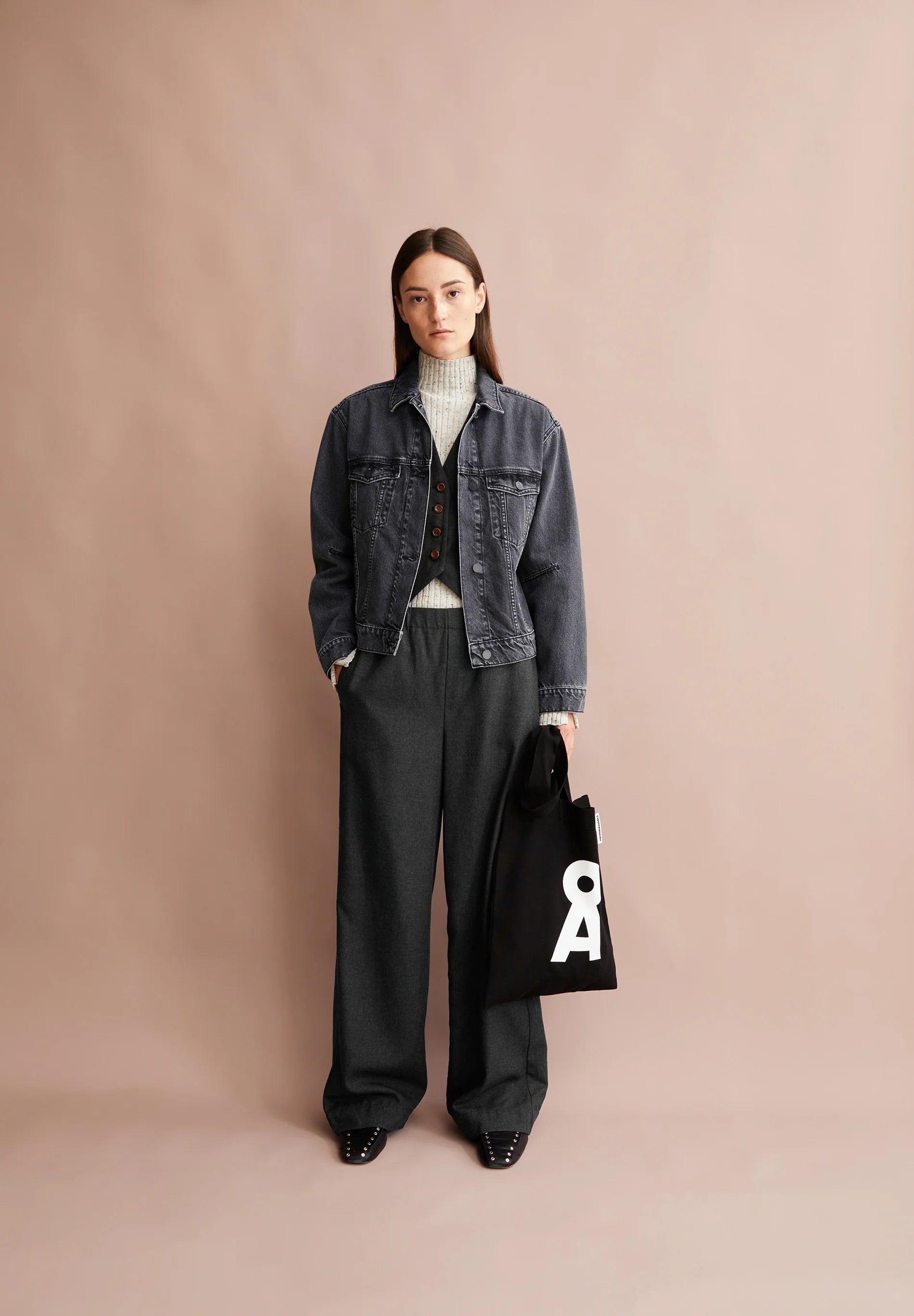Fashionable high-waisted pant from ARMEDANGELS Canada styled with a denim jacket and knit top in Kelowna