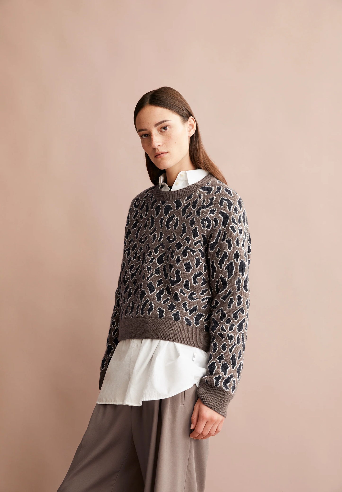 ARMEDANGELS Canada leopard print sweater layered over a white blouse for a stylish and modern look in Kelowna