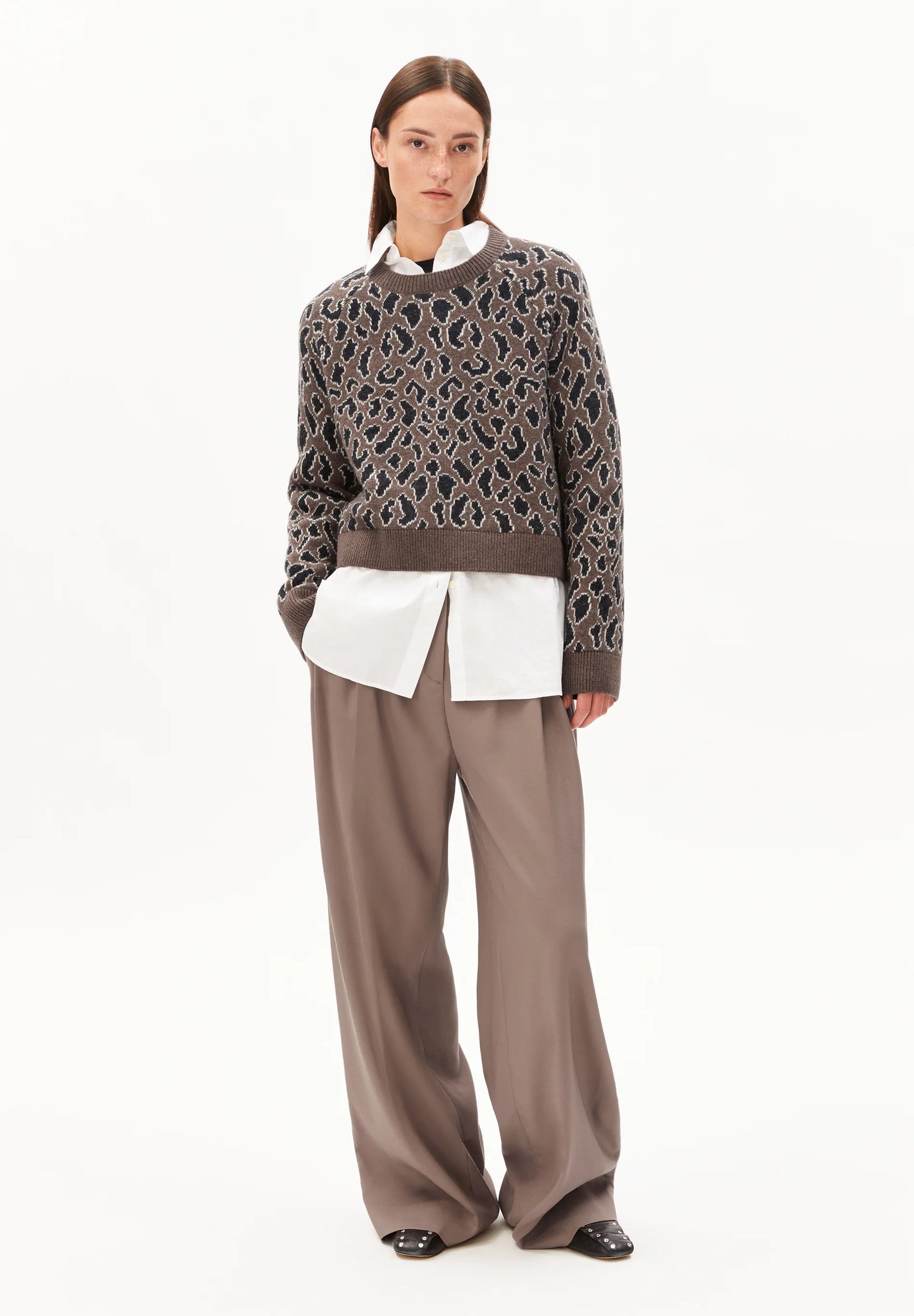 ARMEDANGELS Canada stylish sweater featuring a unique pattern, paired with a white shirt and wide-leg pants in Kelowna