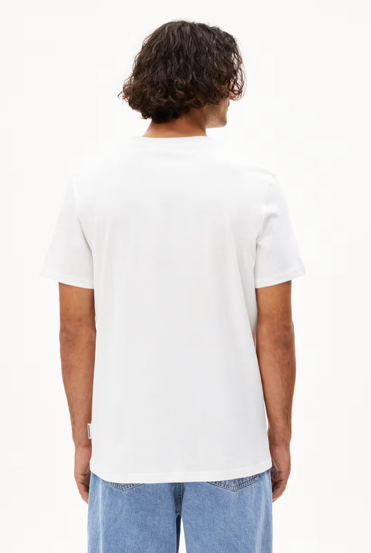 Back view of a man wearing a plain white t-shirt from ARMEDANGELS  Canada paired with blue jeans in Kelowna