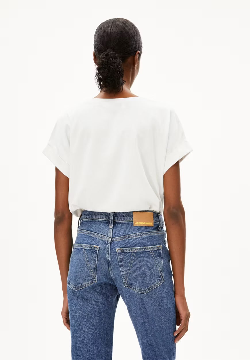 ARMEDANGELS Caanada white short sleeve blouse paired with blue high-waisted jeans shown from back in Kelowna