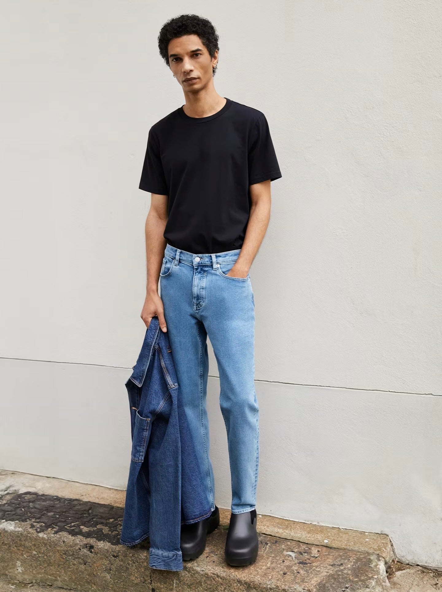 Men's cotton t-shirt in black, paired with light blue jeans for a casual style. ARMEDANGELS Canada