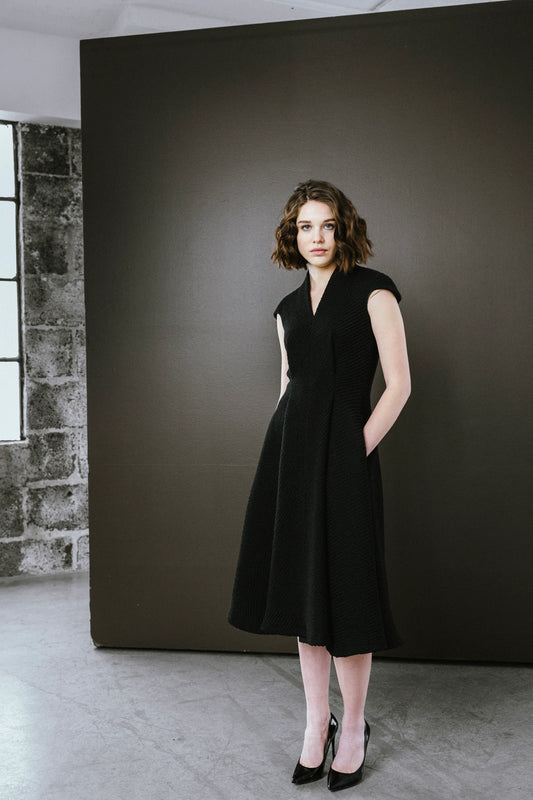 Bodybag by Jude Elegant black dress by BodyBag by Jude, featuring a fitted bodice and flared skirt with pockets in Kelowna