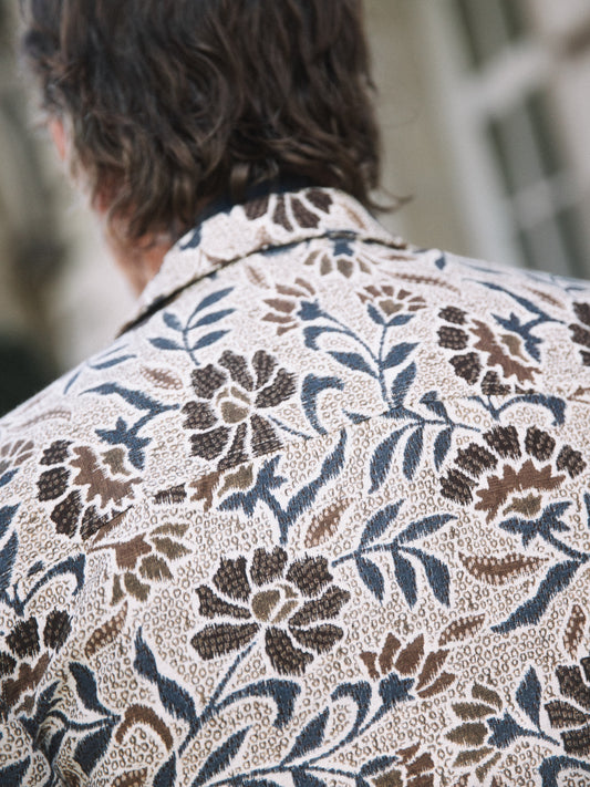 organic men's overshirt Mos Mosh Gallery beige floral print with blue and brown leaves back view in Kelowna