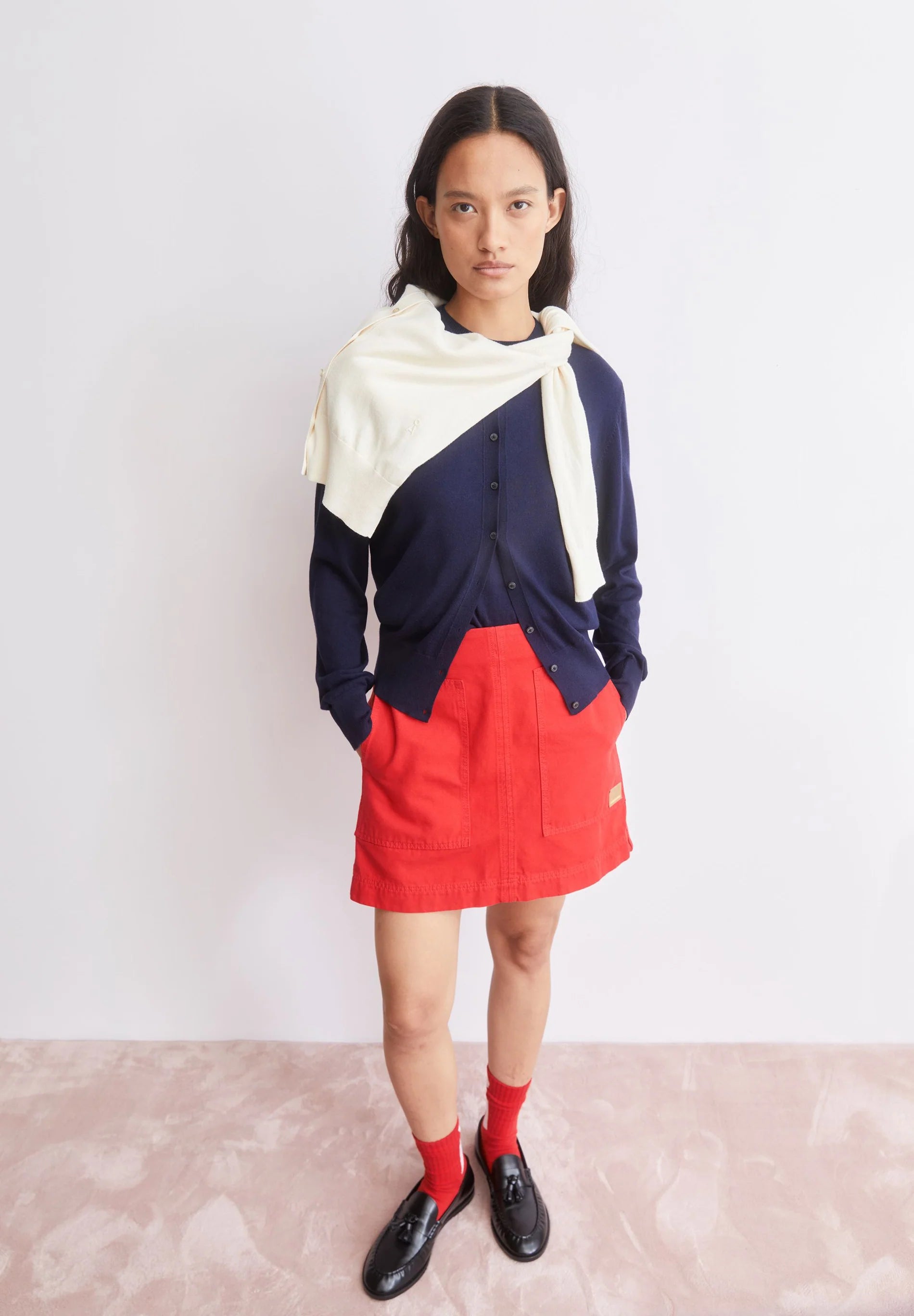 ARMEDANGELS Canada - FINE Knit Cardigan in Tinted Navy styled with an oatmilk sweater and red shorts on model