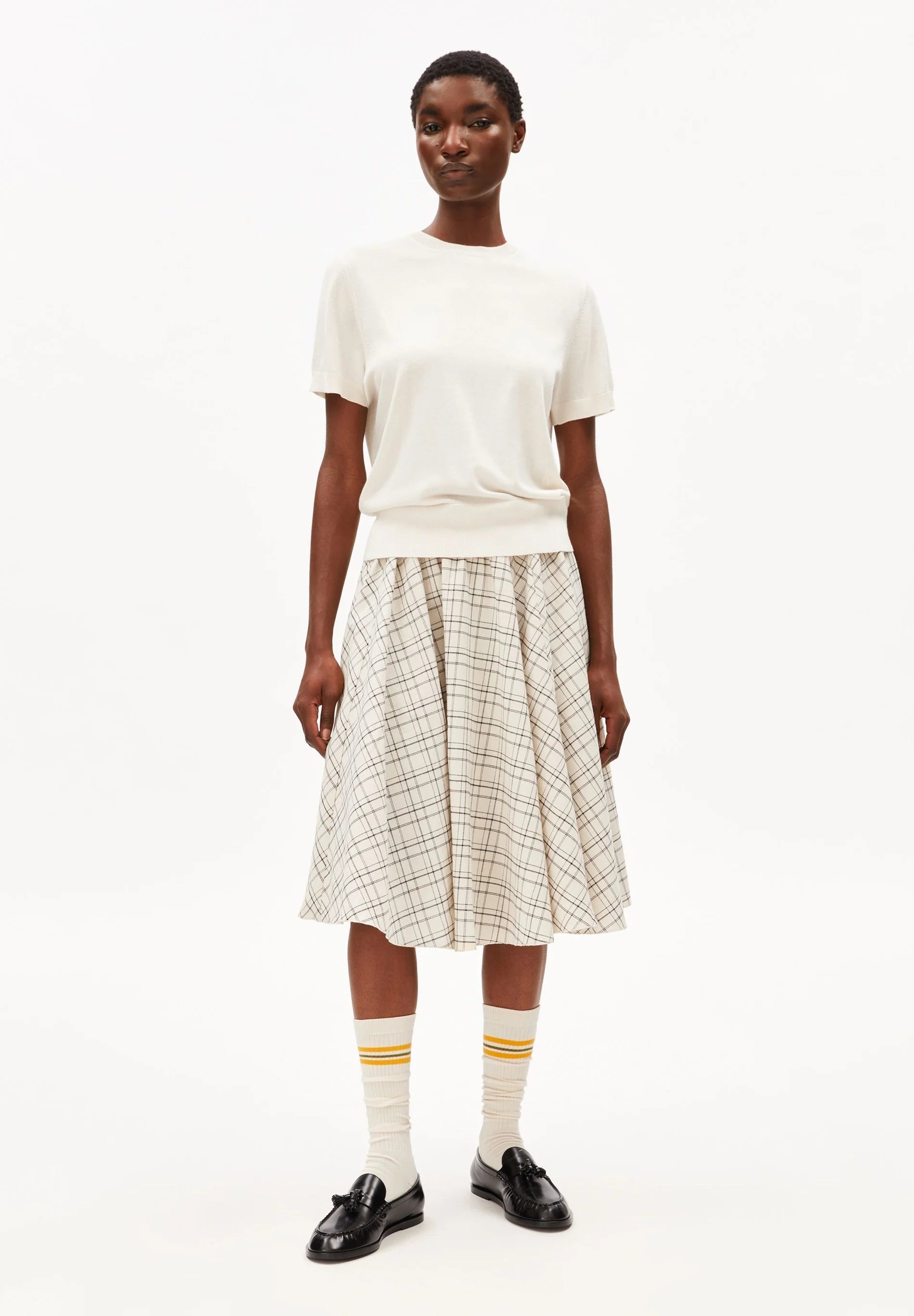 ARMEDANGELS Canada - FINE Knit Sweater in Oatmilk on model with fun socks