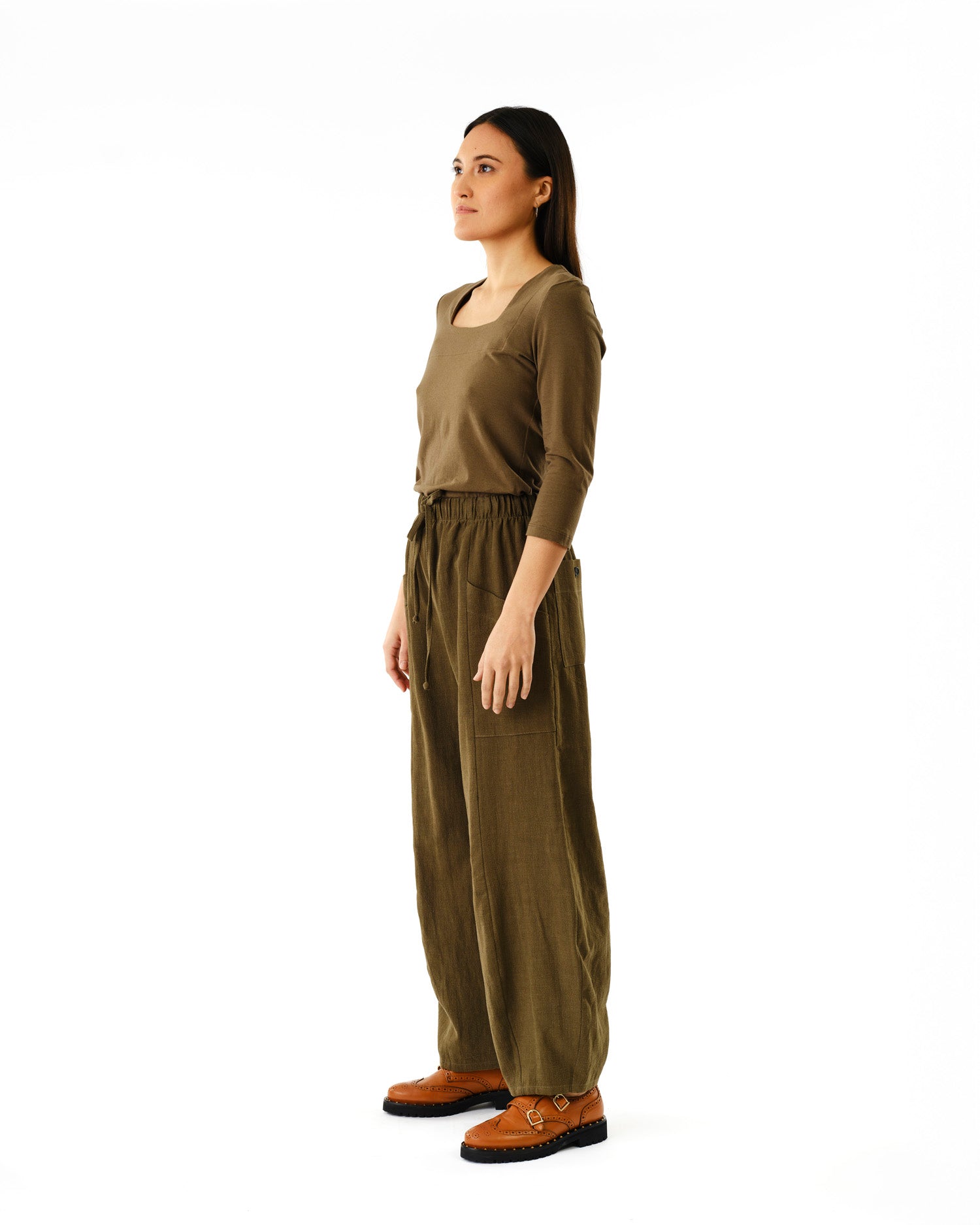 Model in olive green scoop neck top and matching wide leg drawstring pants by Jennifer Glasgow Design in Kelowna