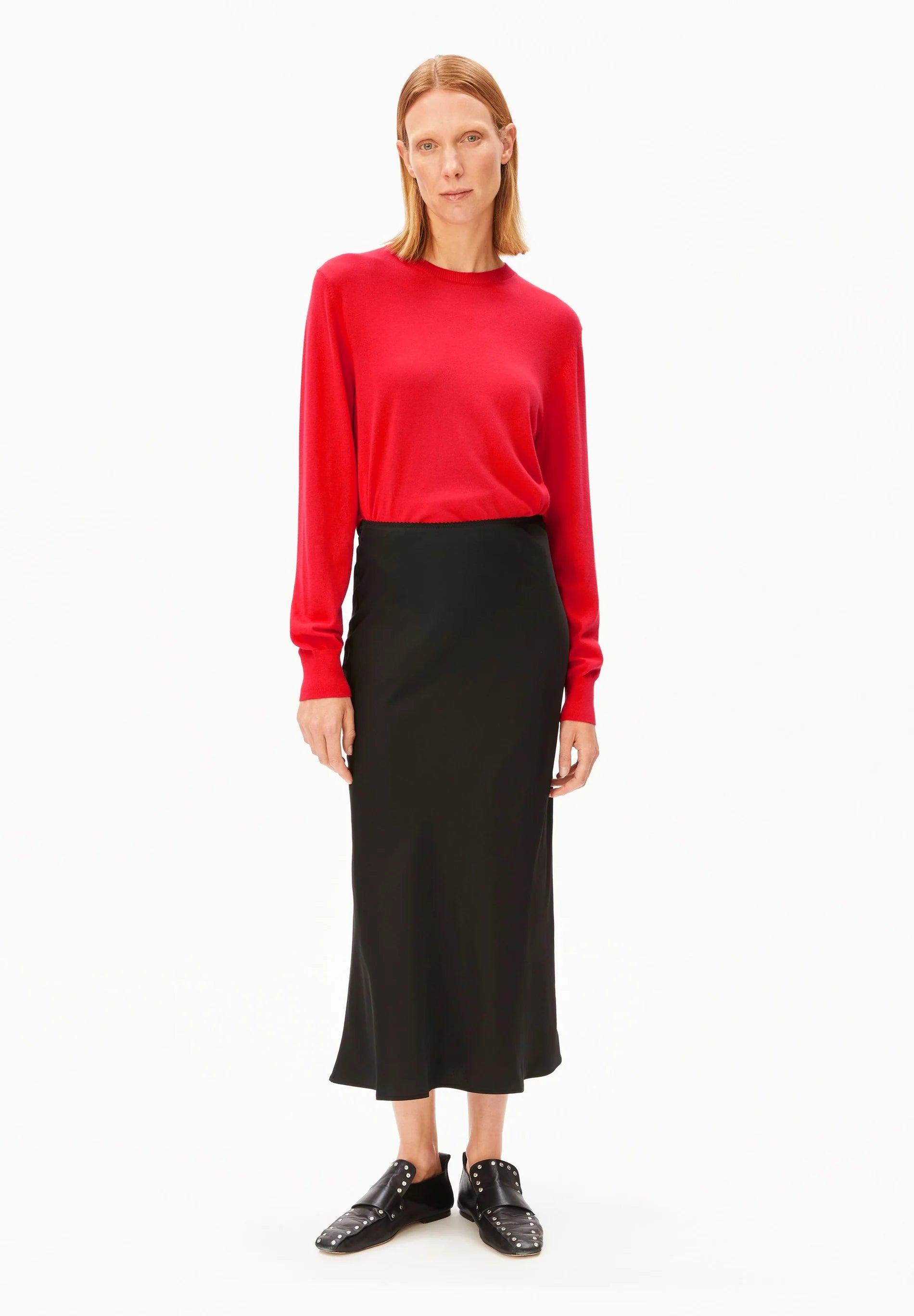 ARMEDANGELS Canada - LENOVAA Satin Slip-Skirt in Black - full view of model also in a red shirt