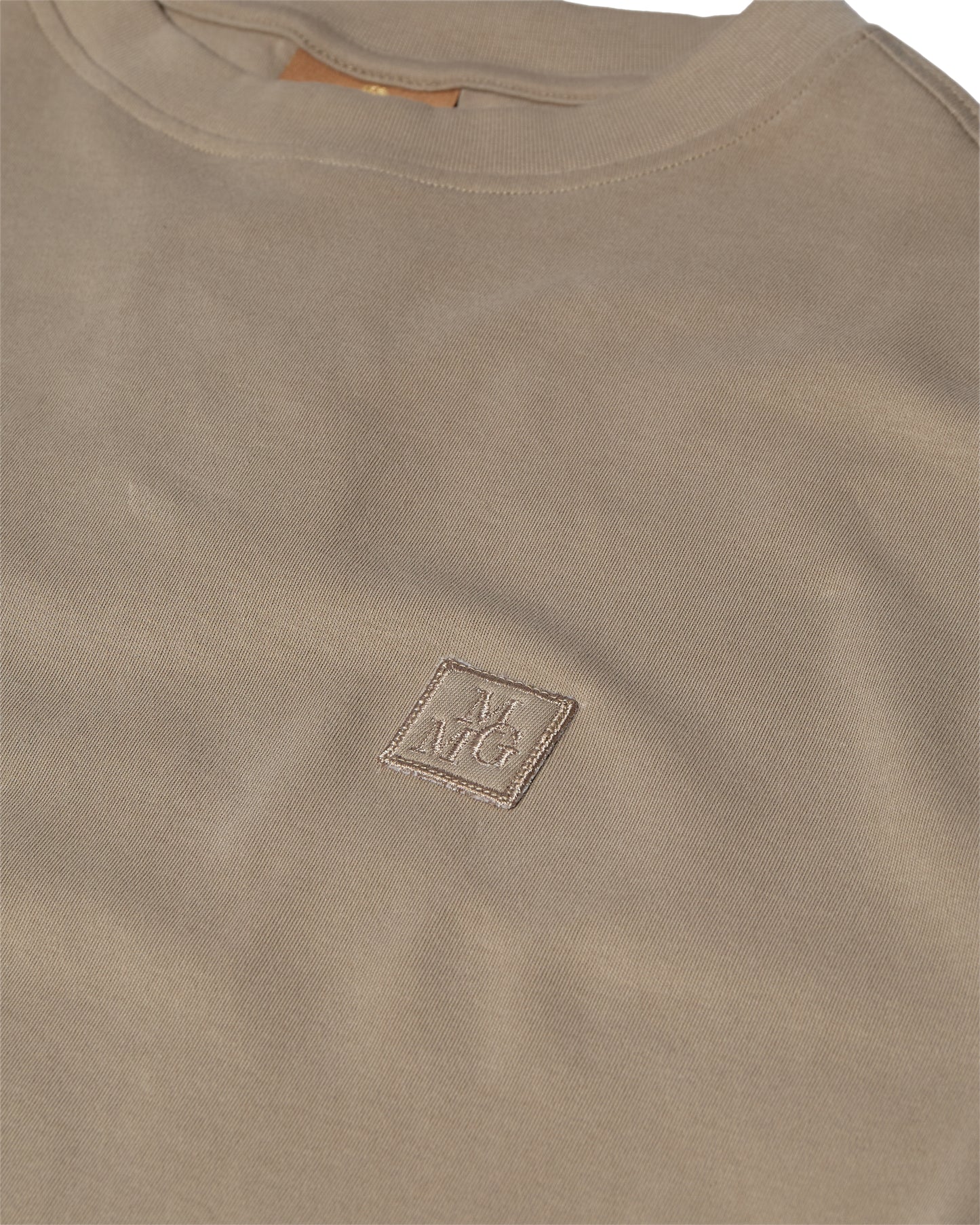 Mos Mosh Gallery beige crewneck t-shirt closeup with small embroidered square logo on chest in Kelowna