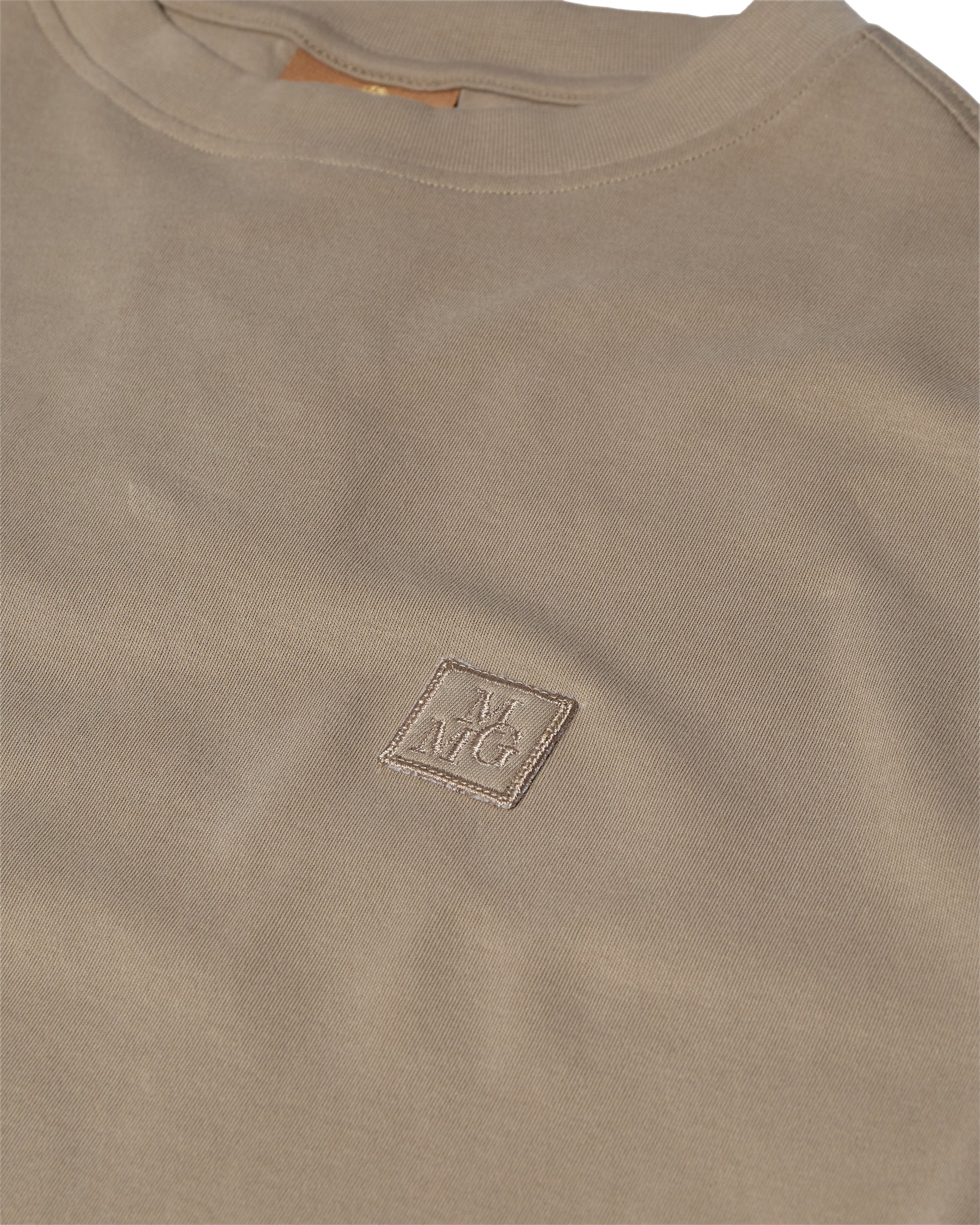Mos Mosh Gallery beige crewneck t-shirt closeup with small embroidered square logo on chest in Kelowna