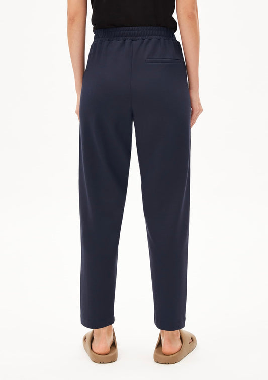 ARMEDANGELS Canada Magdaalena Jersey Pants navy blue pants with elastic waistband and back pocket shown from the rear