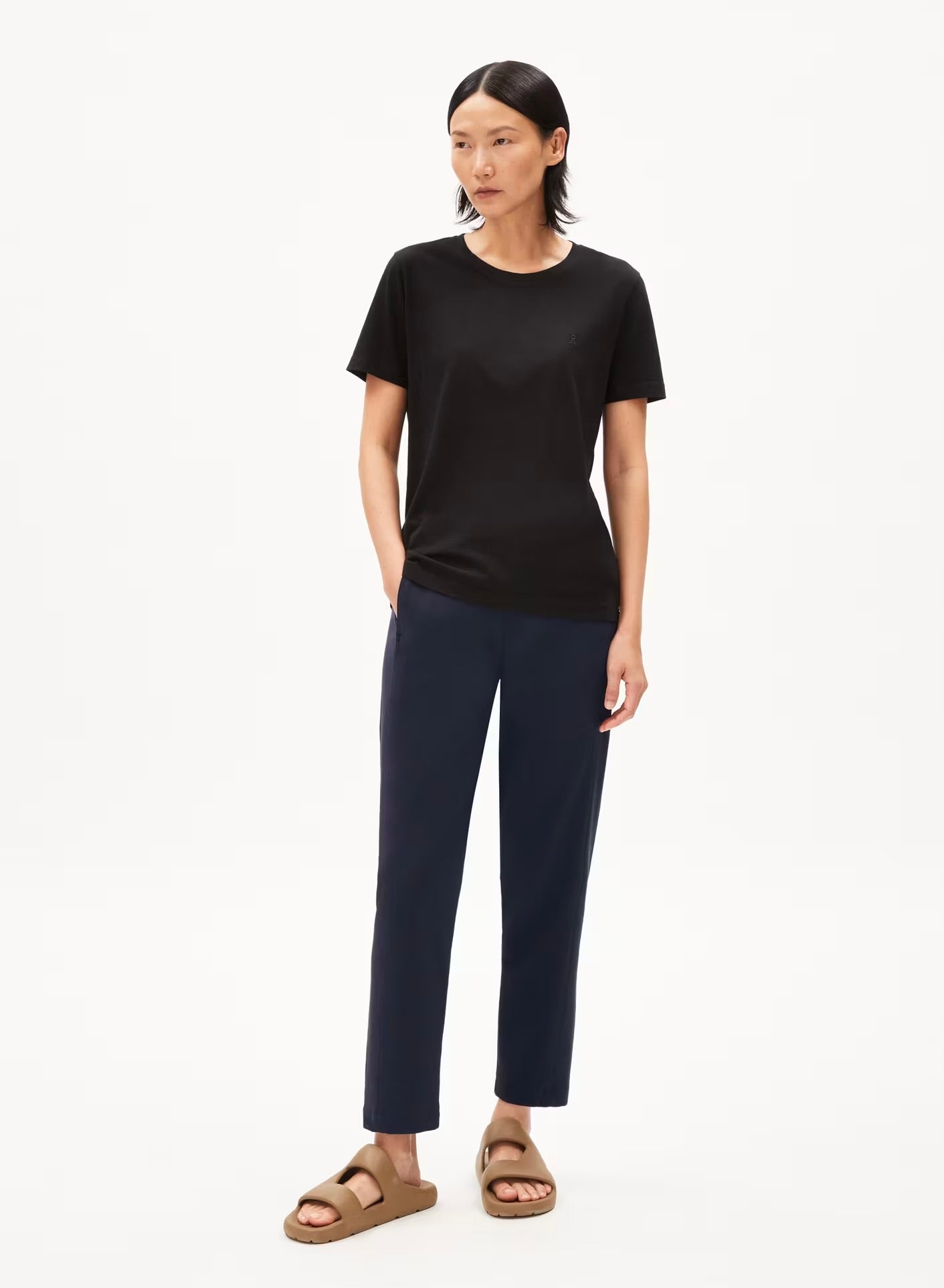 ARMEDANGELS Canada Magdaalena Jersey Pants women's navy blue pants paired with black t-shirt and brown sandals