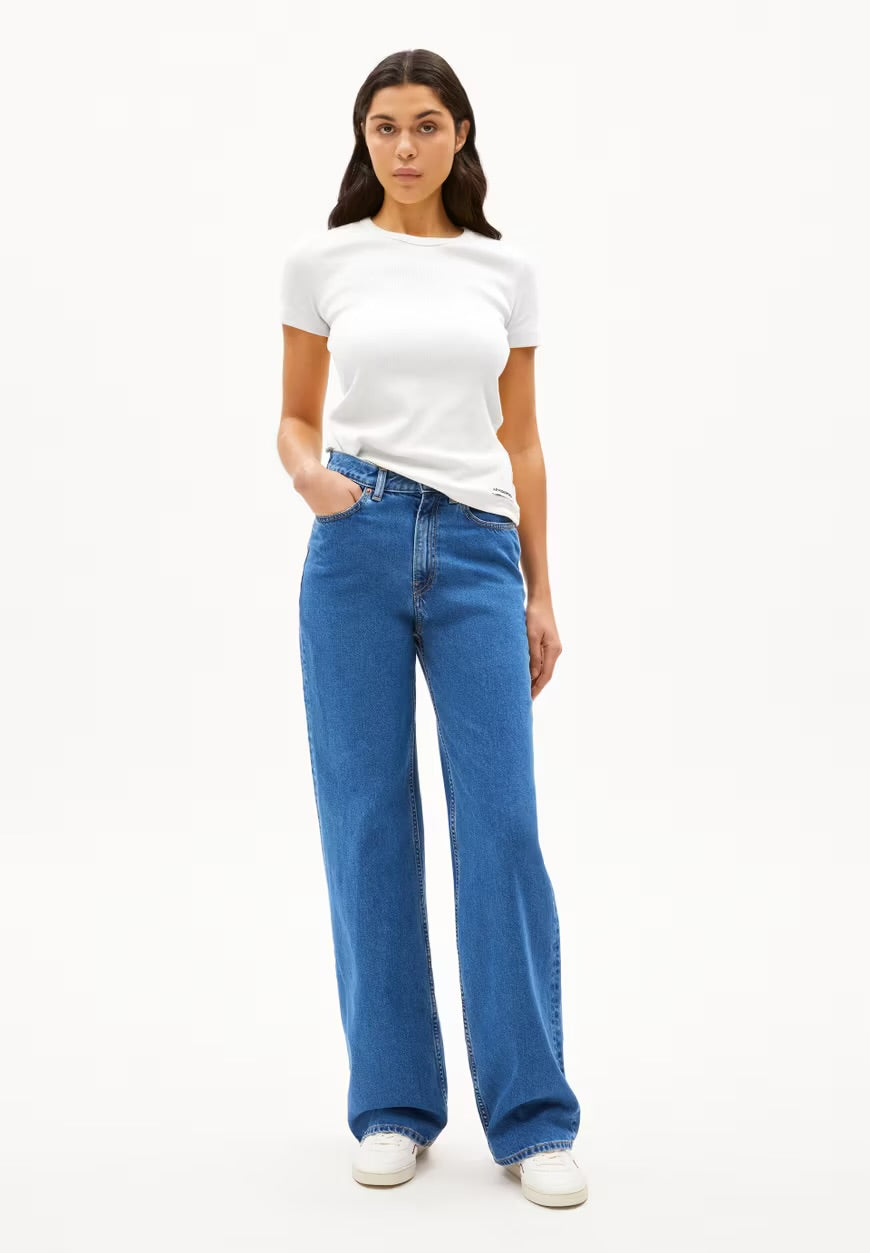ARMEDANGELS  Canadawhite short sleeve tribbed t-shirt paired with blue wide leg jeans and white sneakers