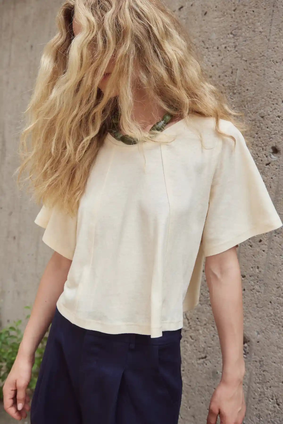 Eve Gravel Sandy Top Cropped Neutral Top by Eve Gravel featuring a relaxed fit and unique shoulder design