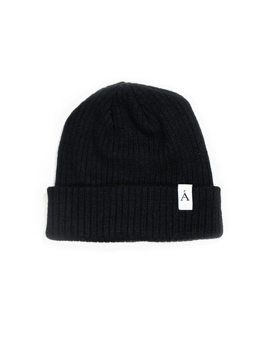 Anian black ribbed knit beanie with folded cuff and white logo label for cold weather in Kelowna